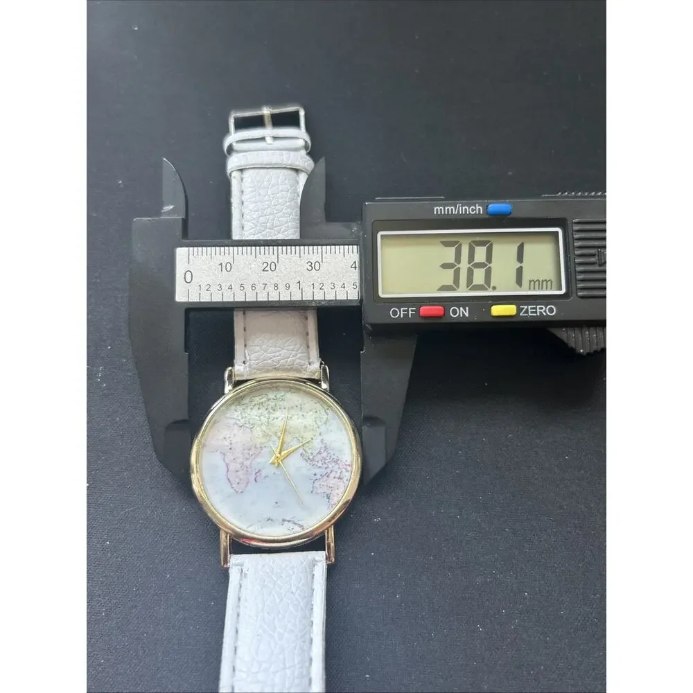 Eastern Hemisphere Gold Tone White Band Quartz Watch